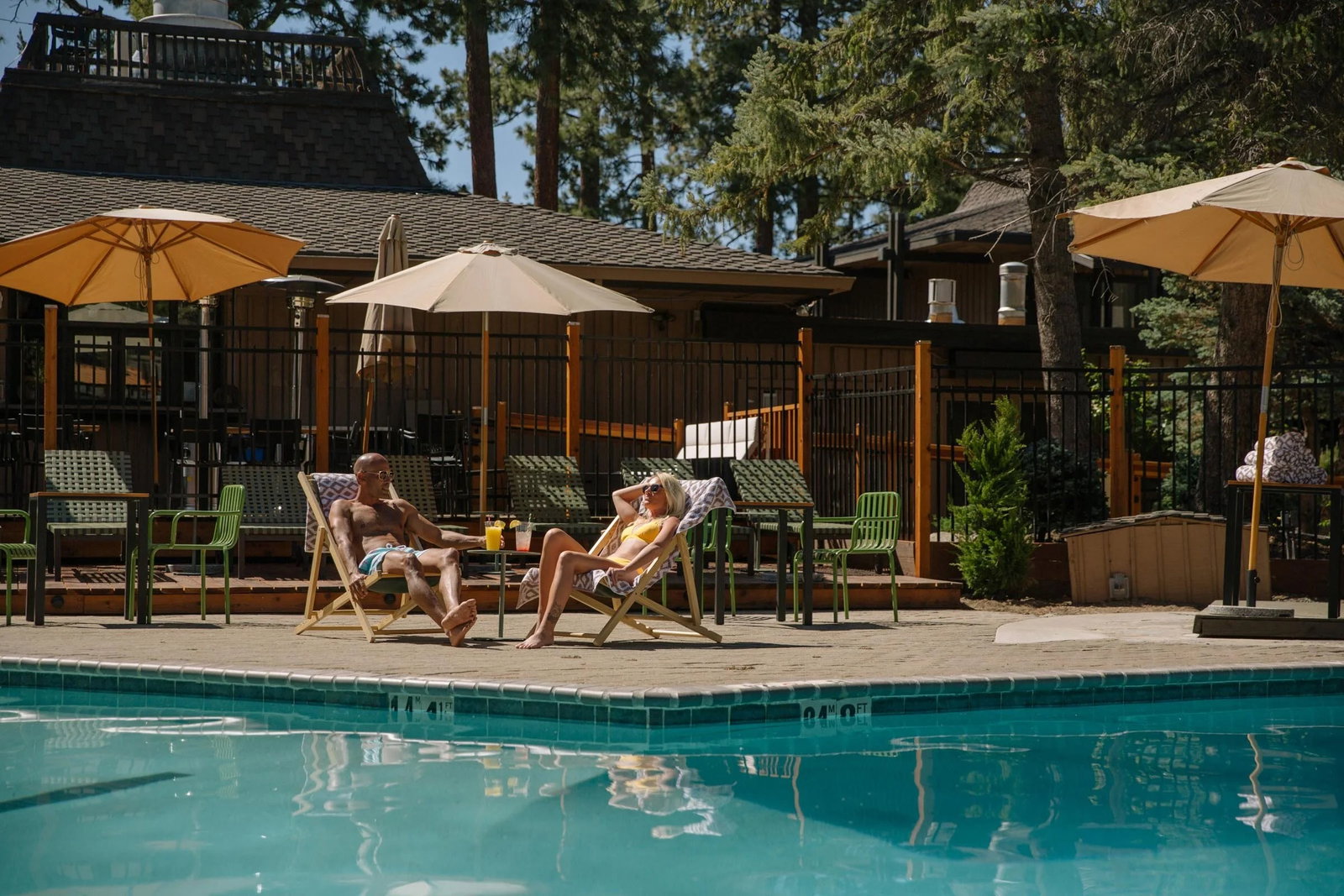 Poolside lounge area at Station House Inn