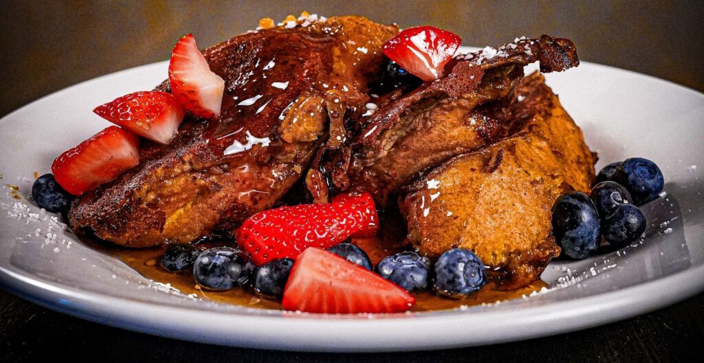 breakfast item at toulouse restaurant featuring pancakes with fruit