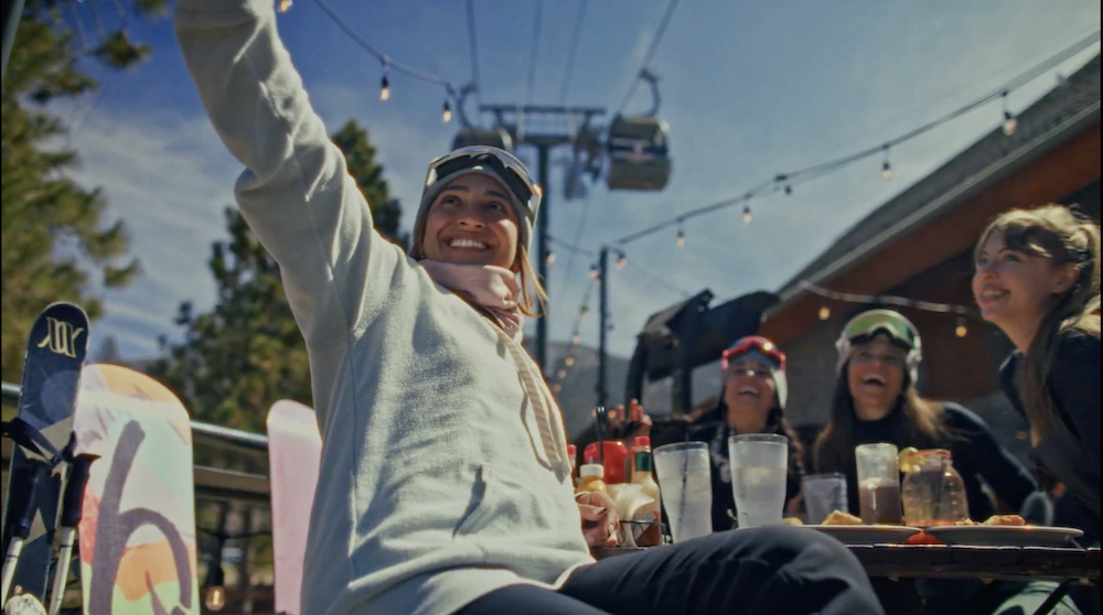 girl taking a selfie of friends in heavenly village with the gondola in the background