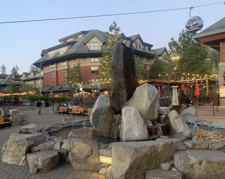 fountain at heavenly village with gondola in the background