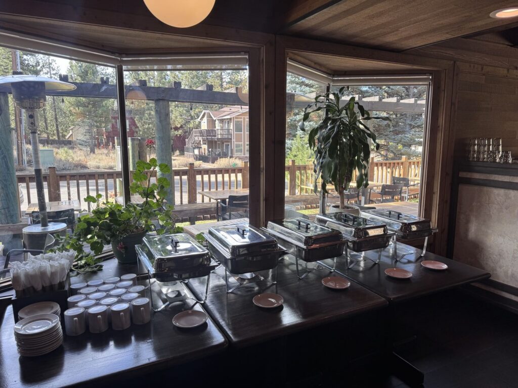 Catering buffet line set up by the windows at Toulouse, Station House Inn